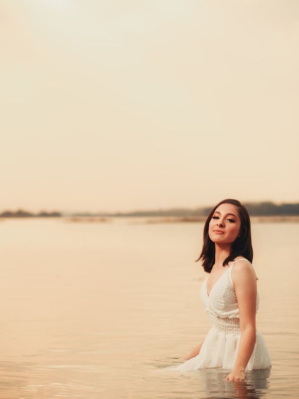 Silhouette of a woman in a balanced, harmonious pose.